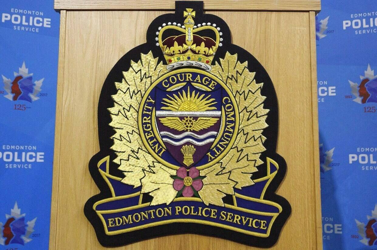 An Edmonton Police Service logo is shown at a press conference in Edmonton, Oct. 2, 2017. Edmonton police say officers have charged four people with separate attacks on people of colour across the city. THE CANADIAN PRESS/Jason Franson