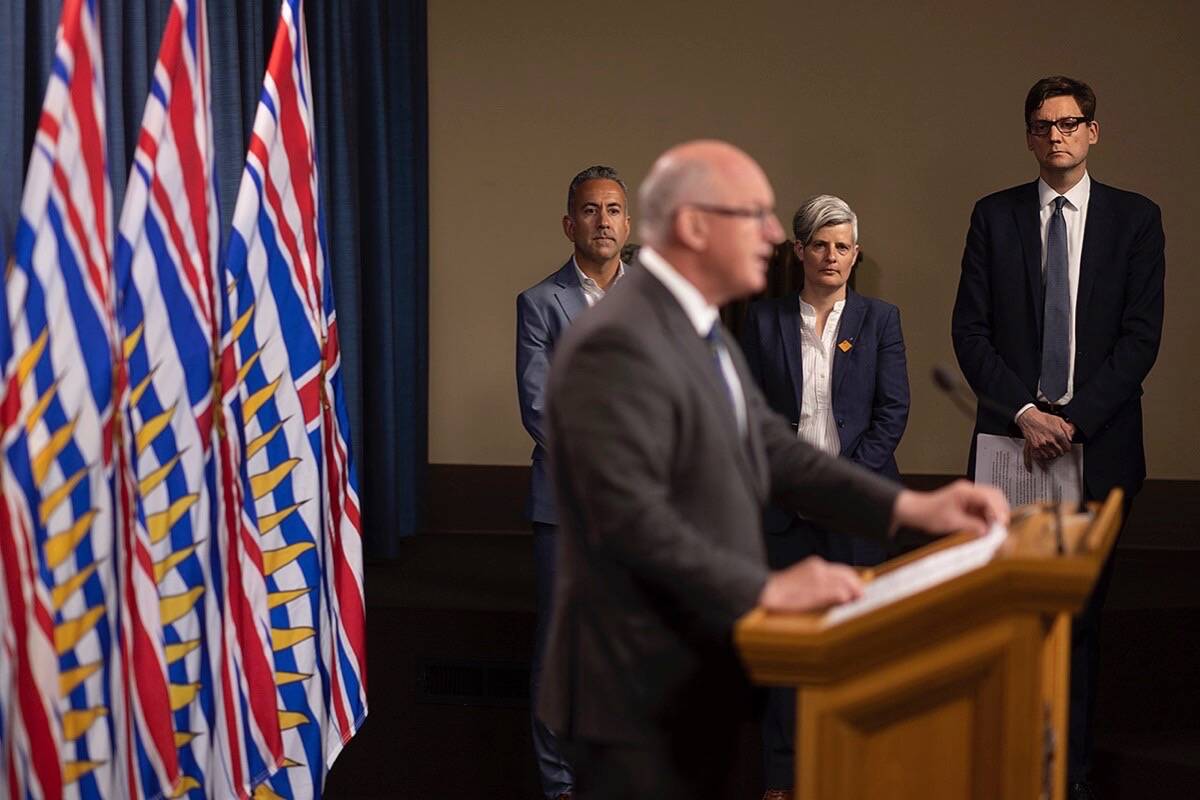 Kelowna Mayor Colin Basran, Victoria Mayor Lisa Helps and Attorney General David Eby listen as B.C. Solicitor General Mike Farnworth describes what police are saying about chronic offenders. (Arnold Lim/Black Press Media)