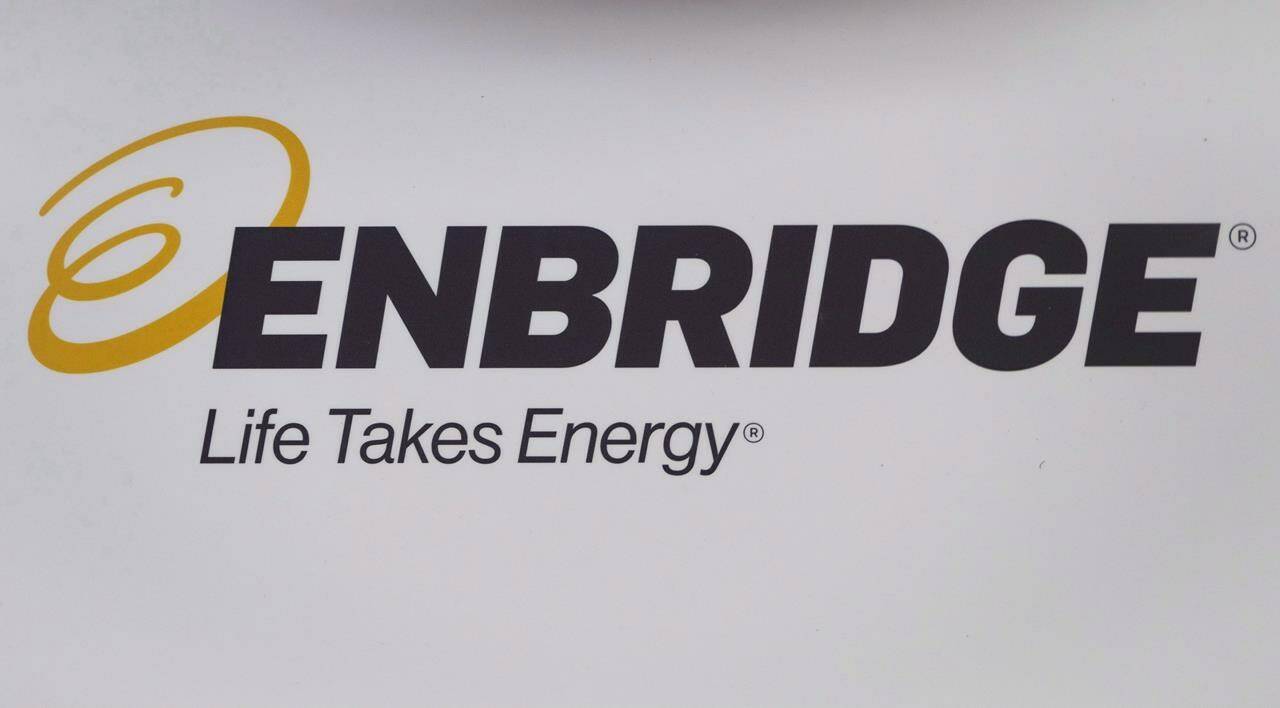 The Enbridge logo is shown at the company’s annual meeting in Calgary on May 9, 2018. Enbridge Inc. says its profits rose in the first quarter as energy demand continues to grow. THE CANADIAN PRESS/Jeff McIntosh