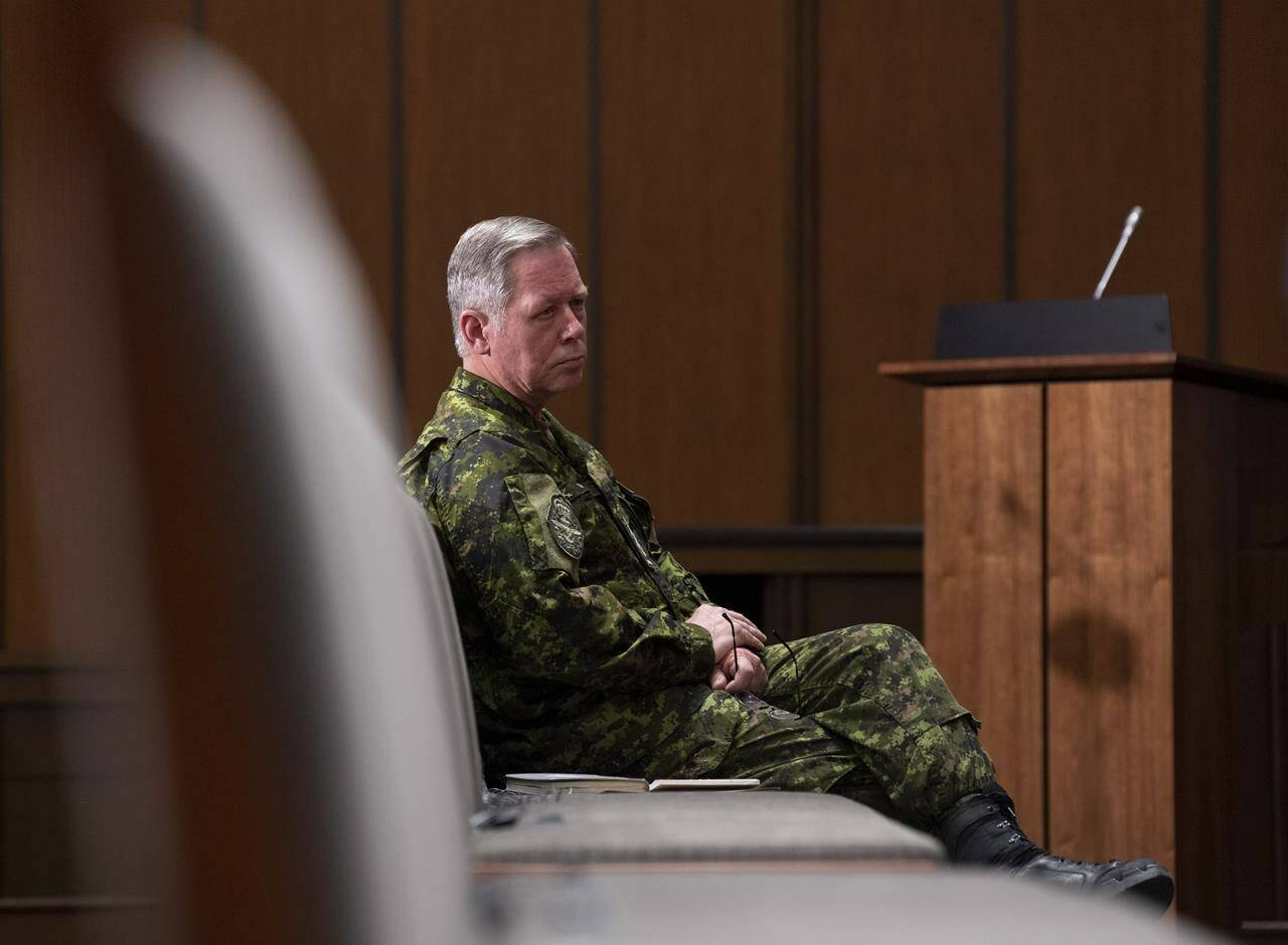 Chief of Defence Staff Jonathan Vance watches a news conference from the front row of seats in Ottawa, Thursday May 7, 2020. THE CANADIAN PRESS/Adrian Wyld