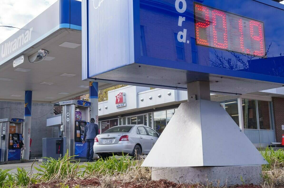 The price of gas is seen as a motorist fills up at a gas station in Montreal on Friday, May 6, 2022. THE CANADIAN PRESS/Paul Chiasson
