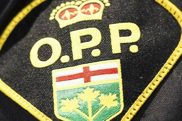 An Ontario Provincial Police logo is shown during a news conference in Barrie, Ont., on April 3, 2019. A British Columbia flight instructor alleges the pilot of a plane that crashed in northern Ontario with two wanted men on board had been advertising flight tours on a plane that wasn’t registered for commercial use. THE CANADIAN PRESS/Nathan Denette