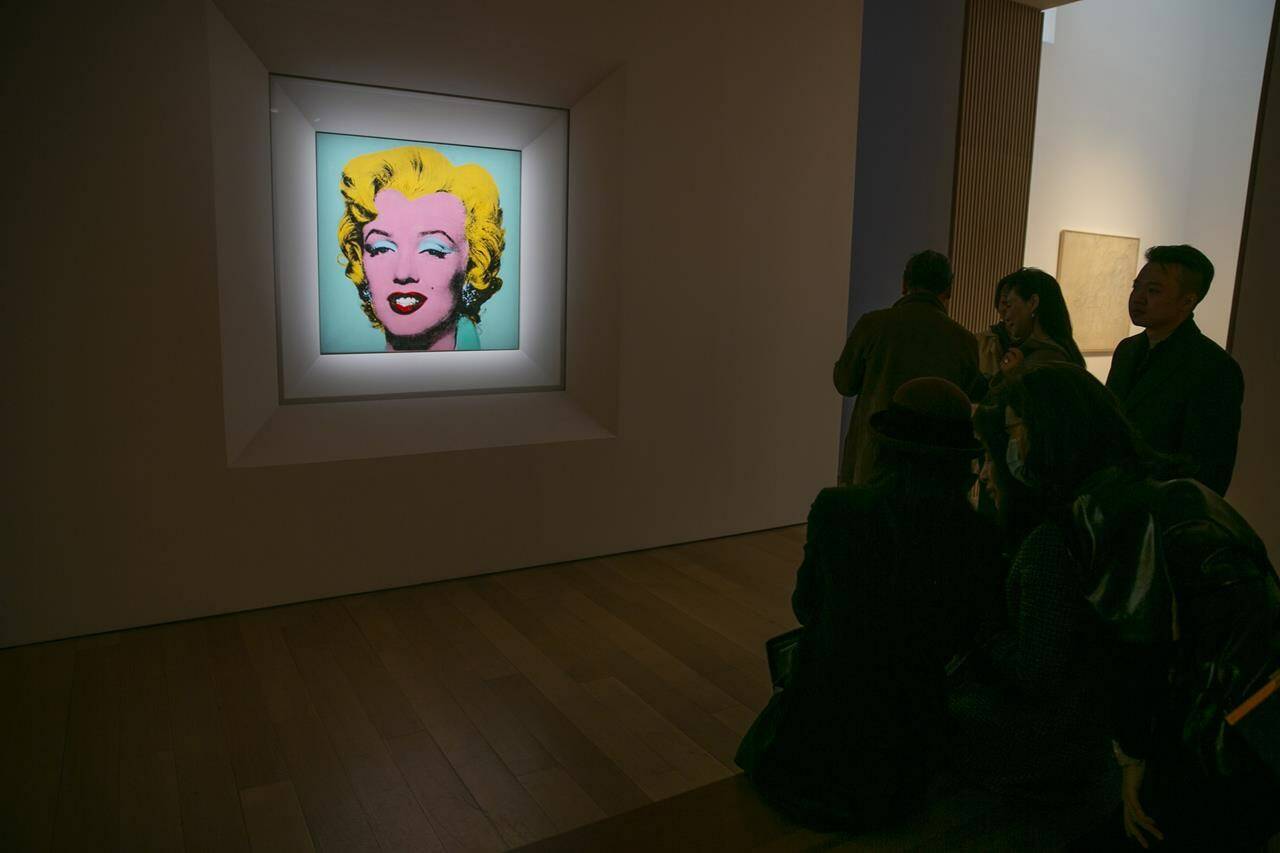 FILE - The 1964 silk-screen image, “Shot Sage Blue Marilyn,” by Andy Warhol is visible in Christie’s showroom in New York City, Sunday, May 8, 2022. The image sold for $195 million, Monday, May 9. (AP Photo/Ted Shaffrey, File)
