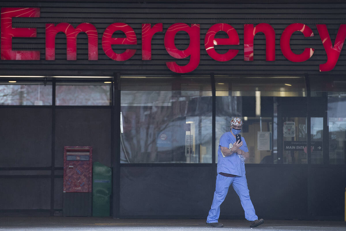 A health care worker is seen outside the Emergency dept. of the Vancouver General Hospital in Vancouver on March 30, 2020. he B.C. government says temporary pandemic pay that was promised to essential workers in mid-May should be coming in October. The stipend was promised to hundreds of thousands of essential workers for work done between March and July and some workers say they’re frustrated it still hasn’t arrived. THE CANADIAN PRESS/Jonathan Hayward