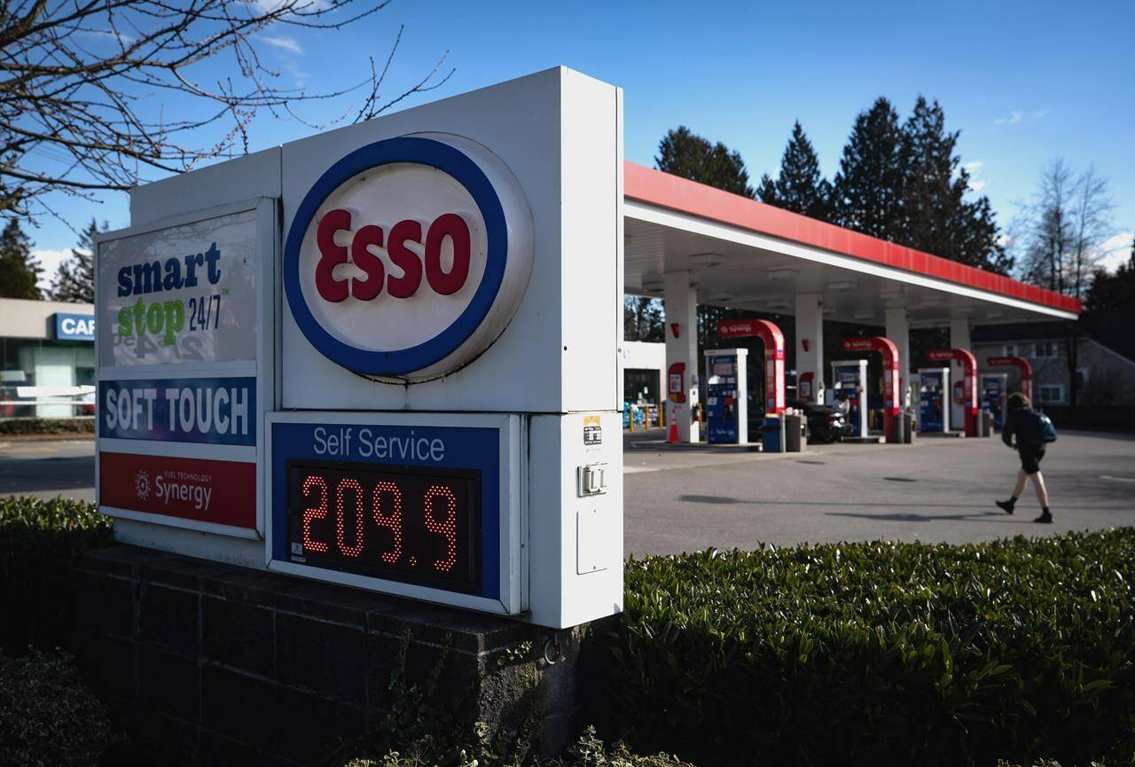 A sign displays the price of a litre of regular grade gasoline at an Esso gas station in Vancouver, on Tuesday, March 8, 2022. THE CANADIAN PRESS/Darryl Dyck
