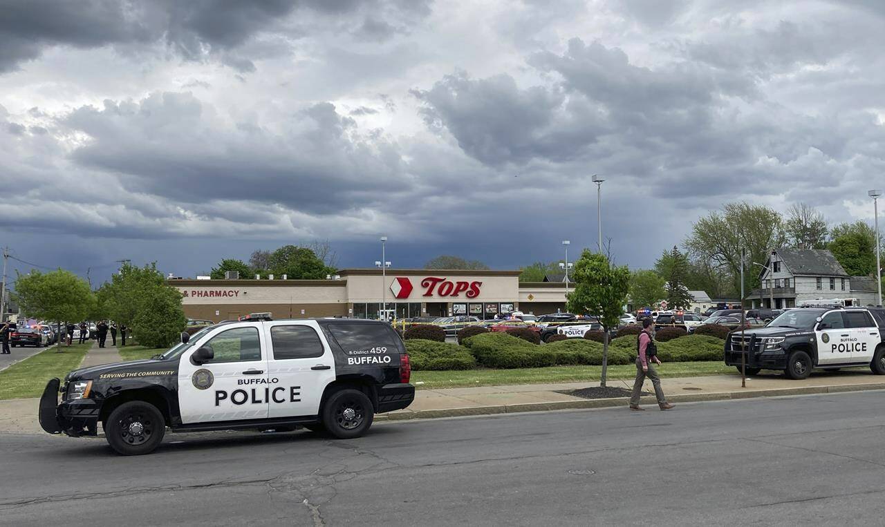Buffalo Police respond to a shooting at Tops Friendly Market in Buffalo, N.Y., Saturday, May 14, 2022. (AP Photo/Carolyn Thompson)