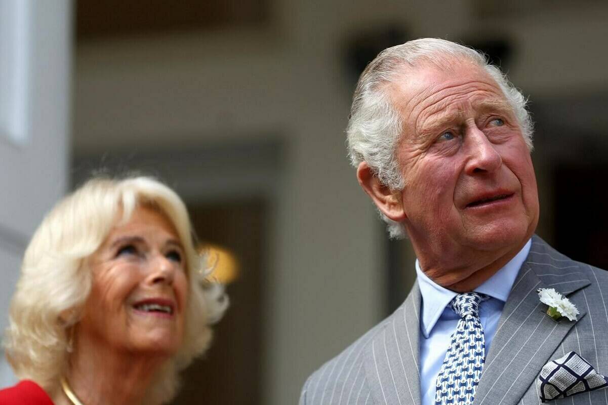 Britain’s Prince Charles and Camilla, Duchess of Cornwall visit Canada House in London, Thursday, May 12, 2022. Prince Charles and his wife Camilla are set to begin a three-day tour of Canada this week that will focus on Indigenous reconciliation and climate change — and on connecting with a Canadian public that is increasingly skeptical of the monarchy. (Hannah McKay/Pool Photo via AP)