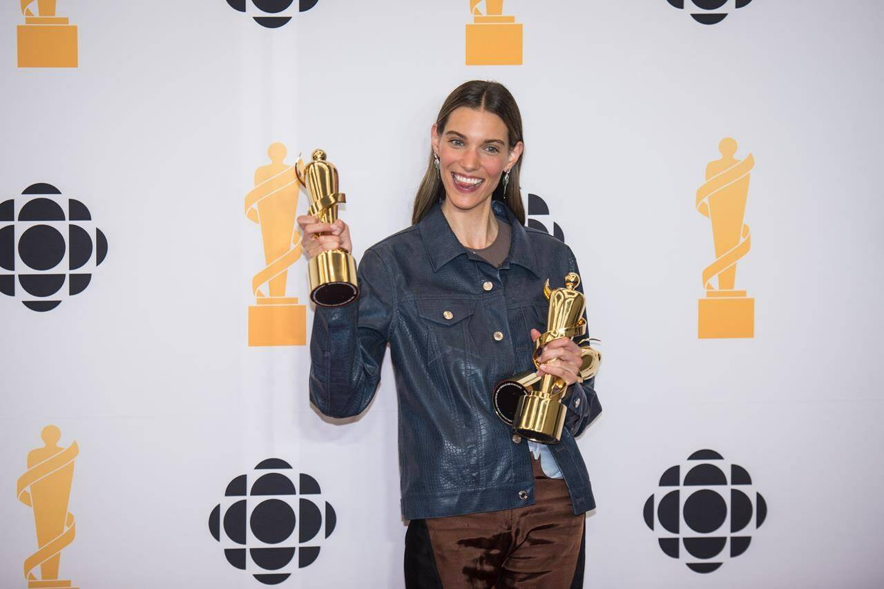 Charlotte Cardin poses for a photograph at the media wall after winning in three different categories during the opening night of the 2022 Juno Awards at the Metro Convention Centre in Toronto, on Saturday, May 14, 2022. THE CANADIAN PRESS/ Tijana Martin