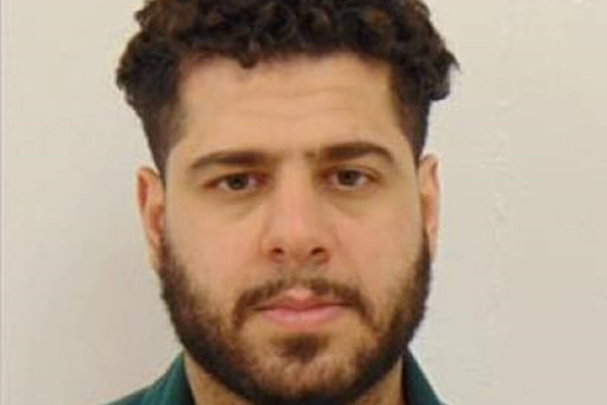 Talal Amer, 29, is seen in an undated police handout photo. Calgary police say they have issued Canada-wide warrants for Amer, the man they believe is responsible for the death of a woman after a shooting led to a crash. THE CANADIAN PRESS/HO-Calgary Police Service