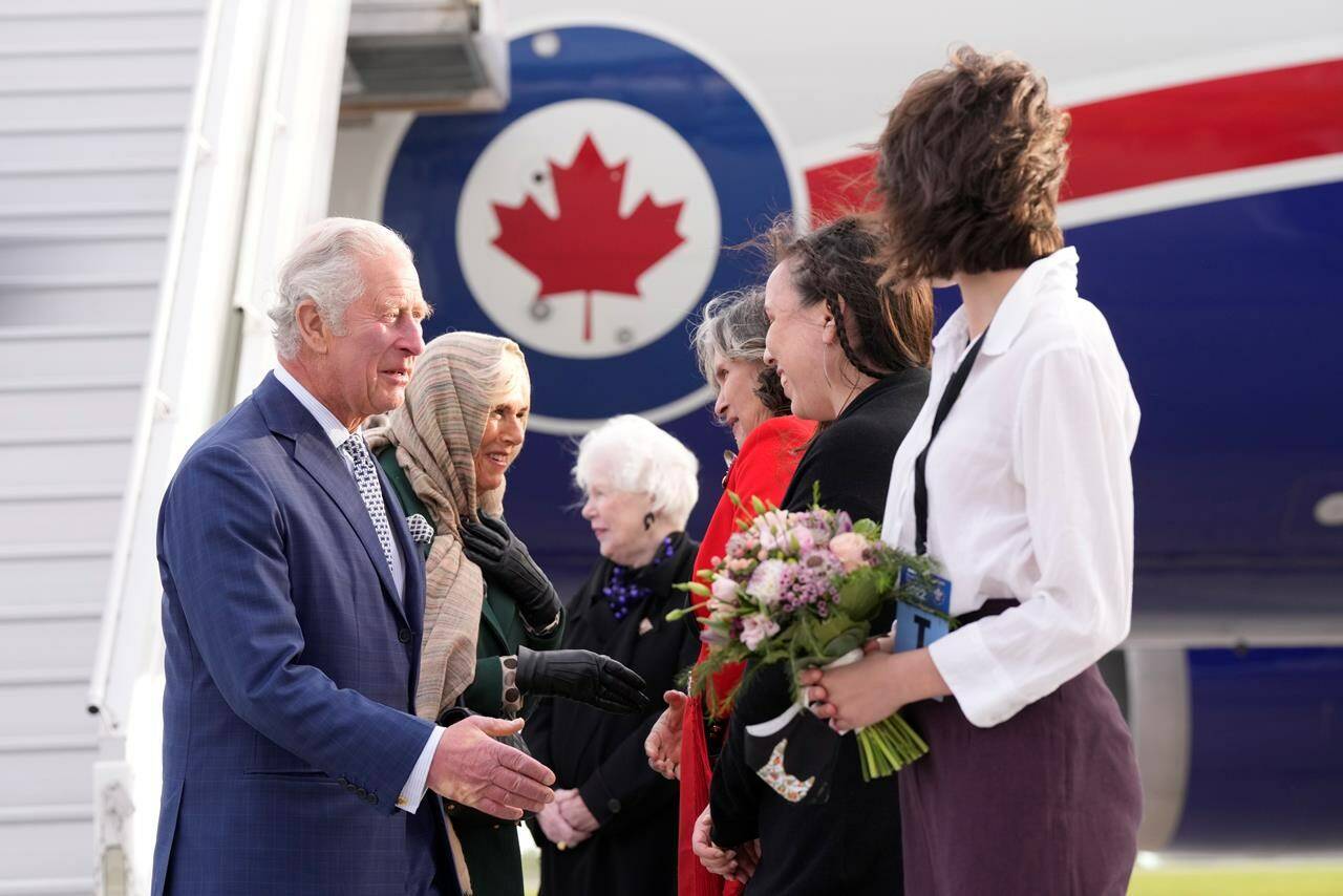 Prince Charles and Camilla, Duchess of Cornwall are greeted as they arrive in Ottawa as part of a three-day Canadian tour, Tuesday, May 17, 2022. THE CANADIAN PRESS/Paul Chiasson