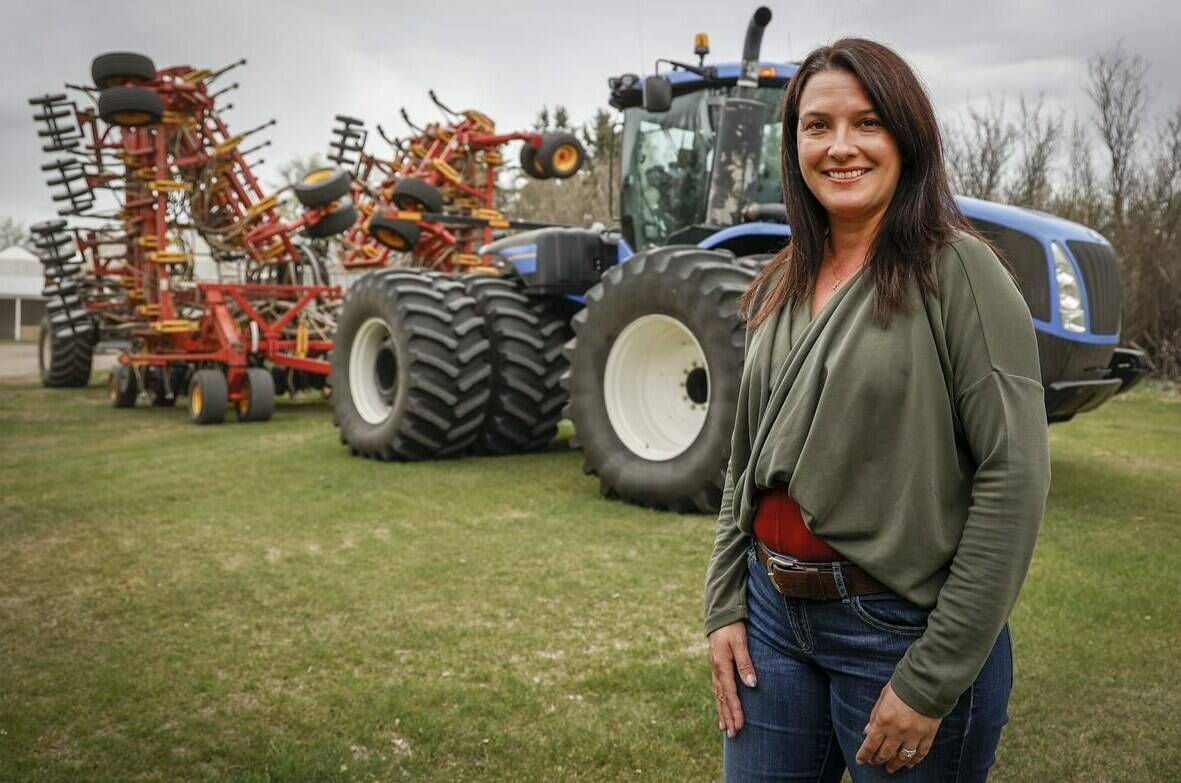 Due to the rising costs of fuel and fertilizer farmers like Tara Sawyer, pictured at her family’s farm near Acme, Alta., Tuesday, May 17, 2022, say this will be the most expensive crop in Canadian history. THE CANADIAN PRESS/Jeff McIntosh