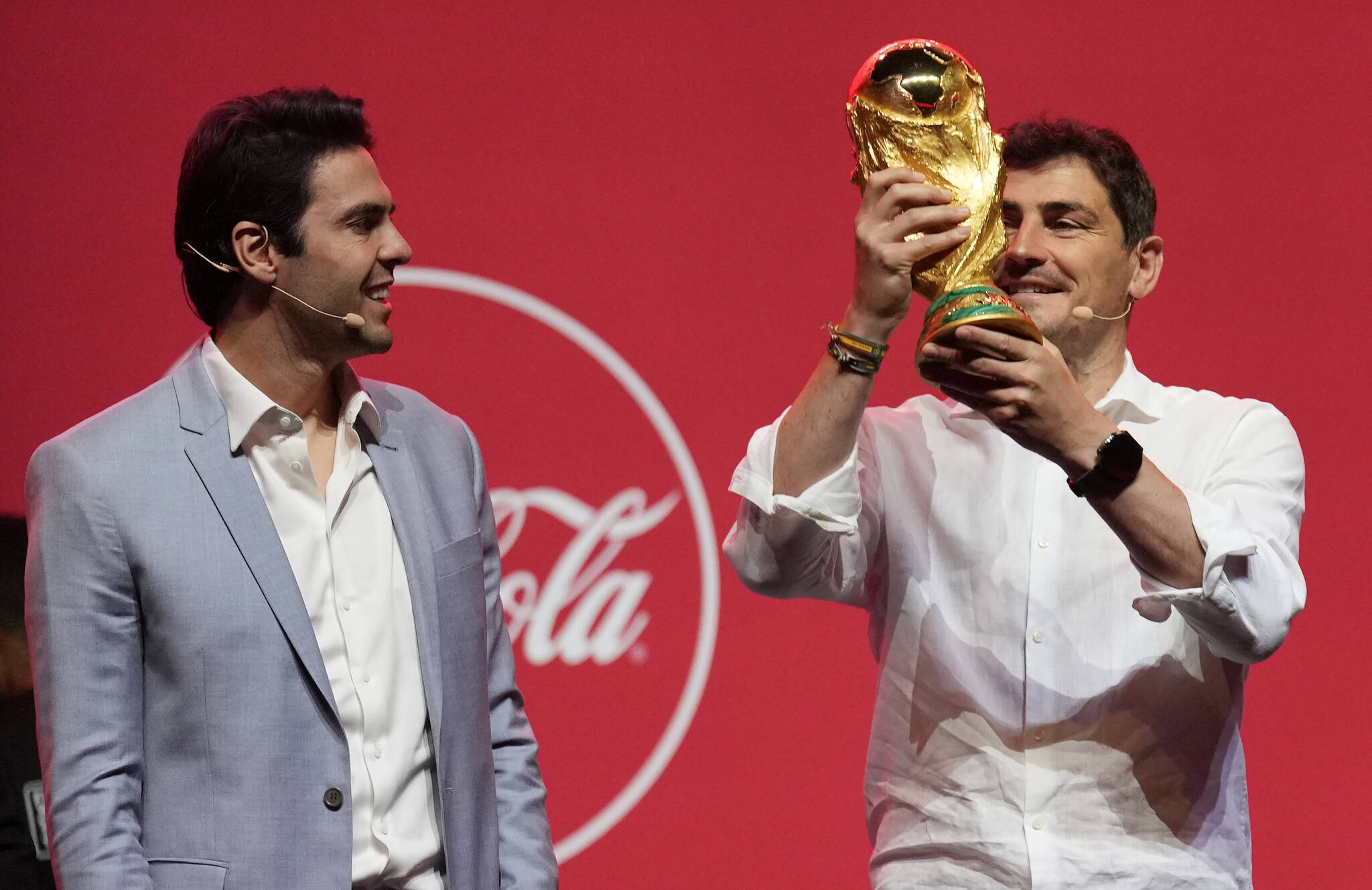 Former Brazilian player KakÃ¡, left, and former Spanish player Iker Casillas present the Qatar FIFA World Cup trophy during the Trophy Tour by Coca-Cola kicked off today with a first-stop event in Dubai, United Arab Emirates, Thursday, May 12, 2022. (AP Photo/Kamran Jebreili)