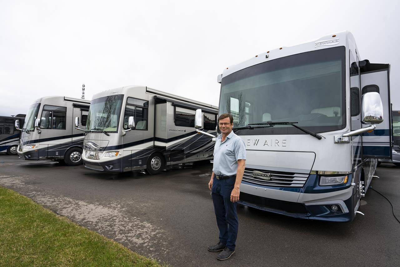 Bucars RV Centre general manager Jeff Redmond with new recreational vehicles on his lot in Balzac, Alta. on Tuesday, May 17, 2022. With gasoline prices hitting all-time highs, Redmond says he’s planning to stay closer to home when RV camping this summer. But he adds recreational vehicles are still one of the most affordable ways to travel as a couple or with a family once other costs are factored in. THE CANADIAN PRESS/Todd Korol