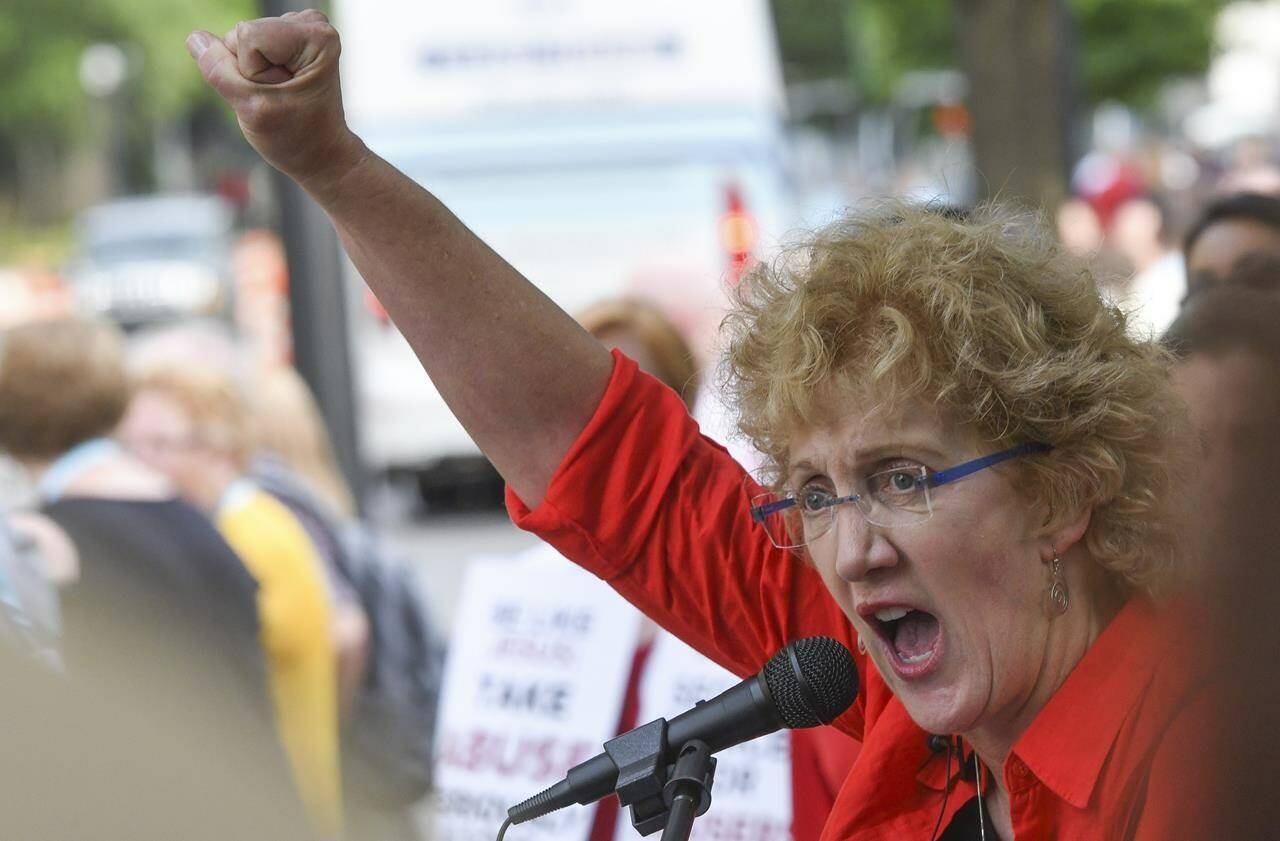 FILE - In this Tuesday, June 11, 2019 file photo, Christa Brown, of Denver, Colo., speaks during a rally in Birmingham, Ala., outside the Southern Baptist Convention’s annual meeting. Brown, an author and retired attorney, says she was abused by a Southern Baptist minister as a child. After reading an investigative report released by the SBC on Sunday, May 22, 2022, Brown said it “fundamentally confirms what Southern Baptist clergy sex abuse survivors have been saying for decades. … I view this investigative report as a beginning, not an end. The work will continue.” (AP Photo/Julie Bennett)