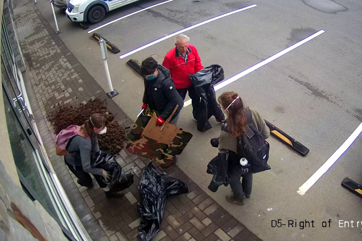 West Shore RCMP released photos, taken from seucrity camera footage, of the suspects who dumped the manure outside the premier's Langford office. (Courtesy of West Shore RCMP)