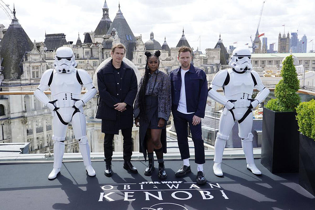From left, actors Hayden Christensen, Moses Ingram and Ewan McGregor, pose for photographers at the photocall for the Disney+ series Obi-Wan Kenobi, at the Corinthia Hotel in London, Thursday, May 12, 2022. (Ian West/PA via AP)