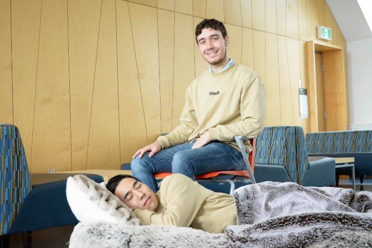 Noah Silverman and Yuki Kinoshita demonstrating the use of a Plufl dog bed for humans.
(The University of British Columbia)