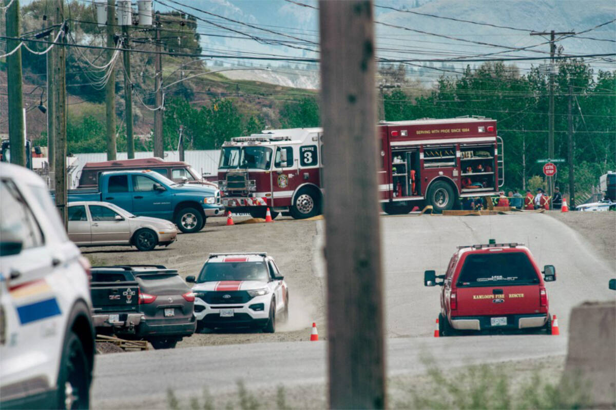 First responders, including police, Kamloops Fire Rescue and the BC Ambulance Service are seen at the corner of Carrier Street and Athabasca Street East in the Mount Paul Industrial Park just before noon on Thursday, May 26. An ammonia leak was reported in the area around 11 a.m., with eight taken to hospital. (Dave Eagles/Kamloops This Week)