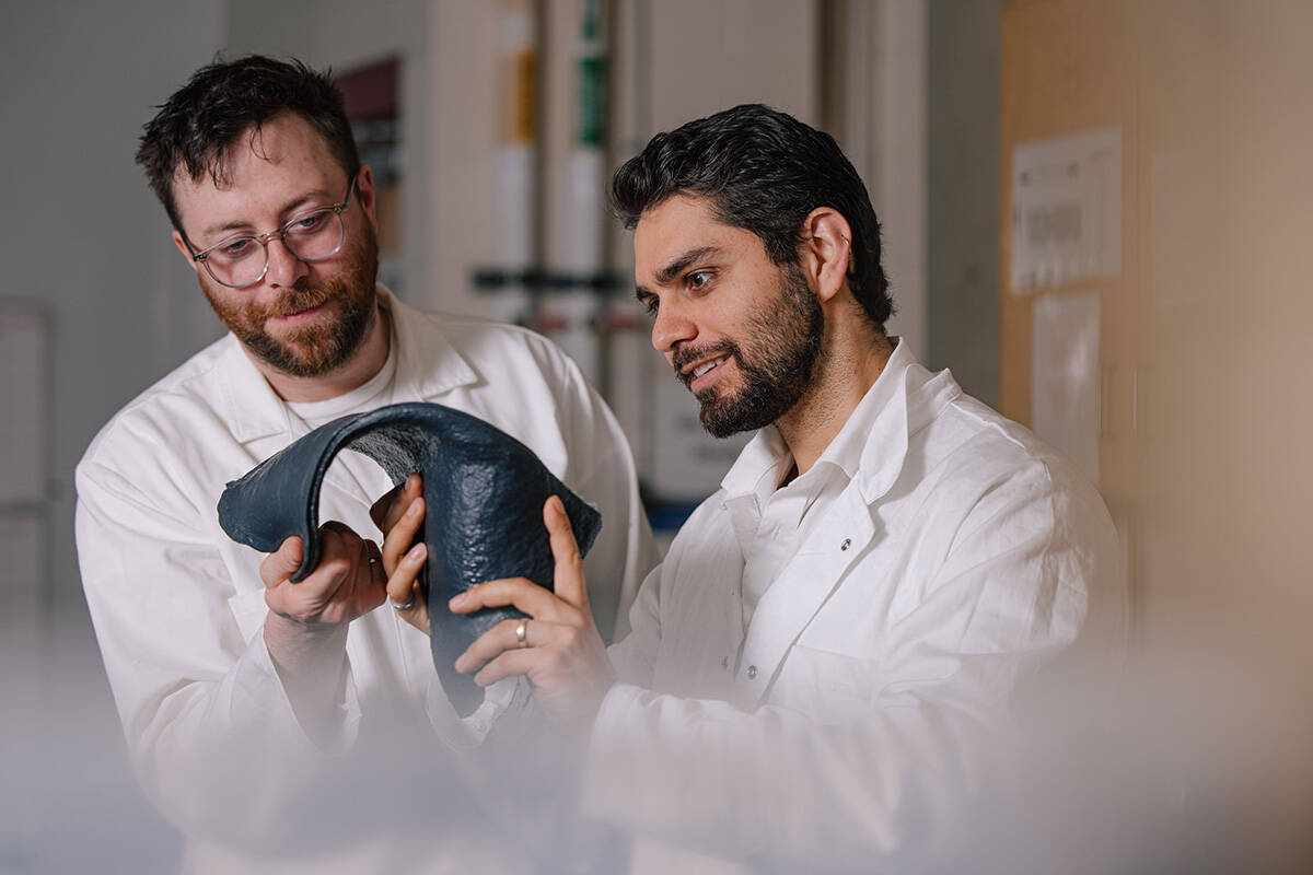 Bioform’s Rami Younes (right) and Jordan MacKenzie (left) showing a sheet of the bioplastic. (Credit: Kai Jacobson/UBC Applied Science)
