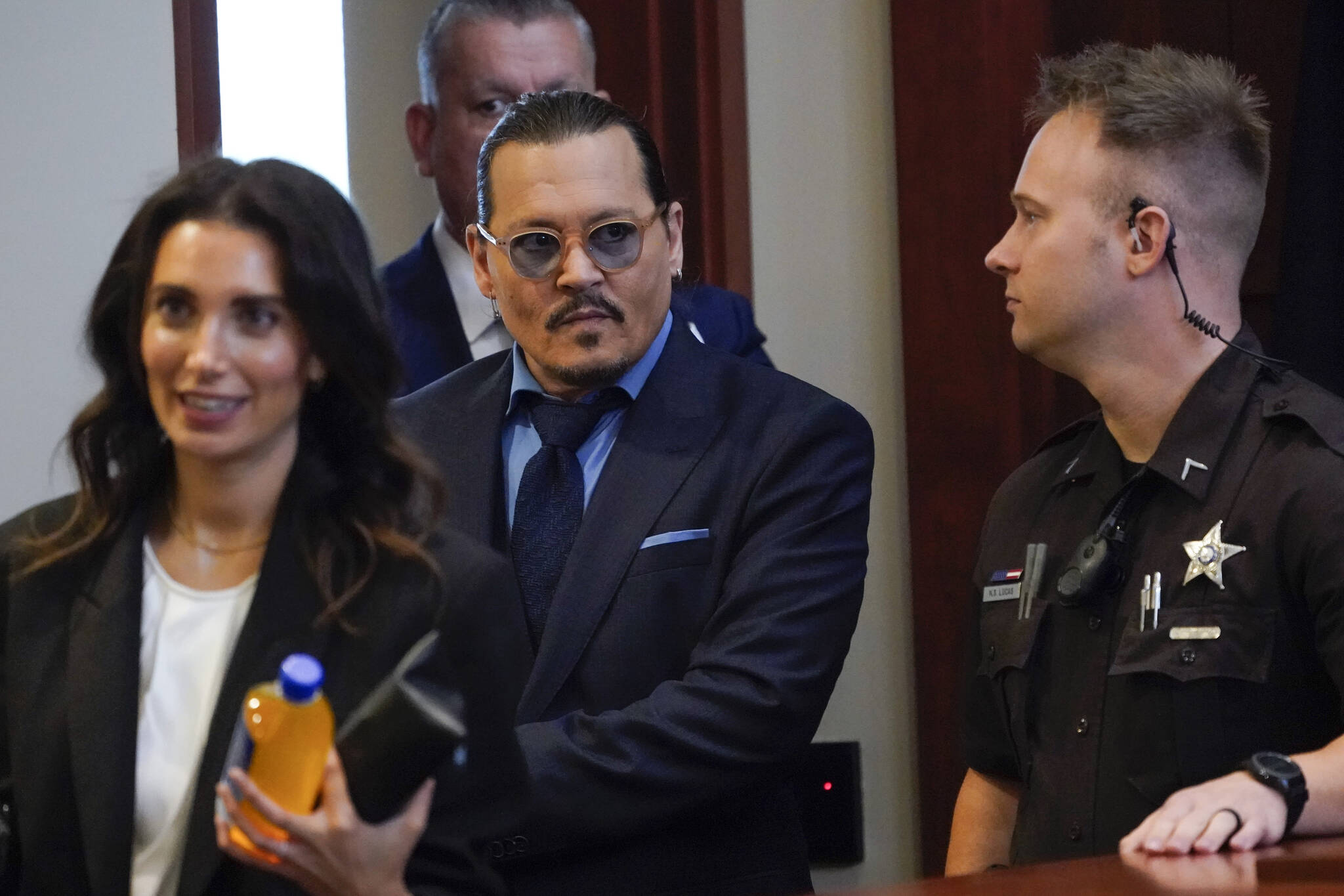 Actor Johnny Depp arrives in the courtroom for closing arguments at the Fairfax County Circuit Courthouse in Fairfax, Va., Friday, May 27, 2022. Depp sued his ex-wife Amber Heard for libel in Fairfax County Circuit Court after she wrote an op-ed piece in The Washington Post in 2018 referring to herself as a “public figure representing domestic abuse.” (AP Photo/Steve Helber, Pool)