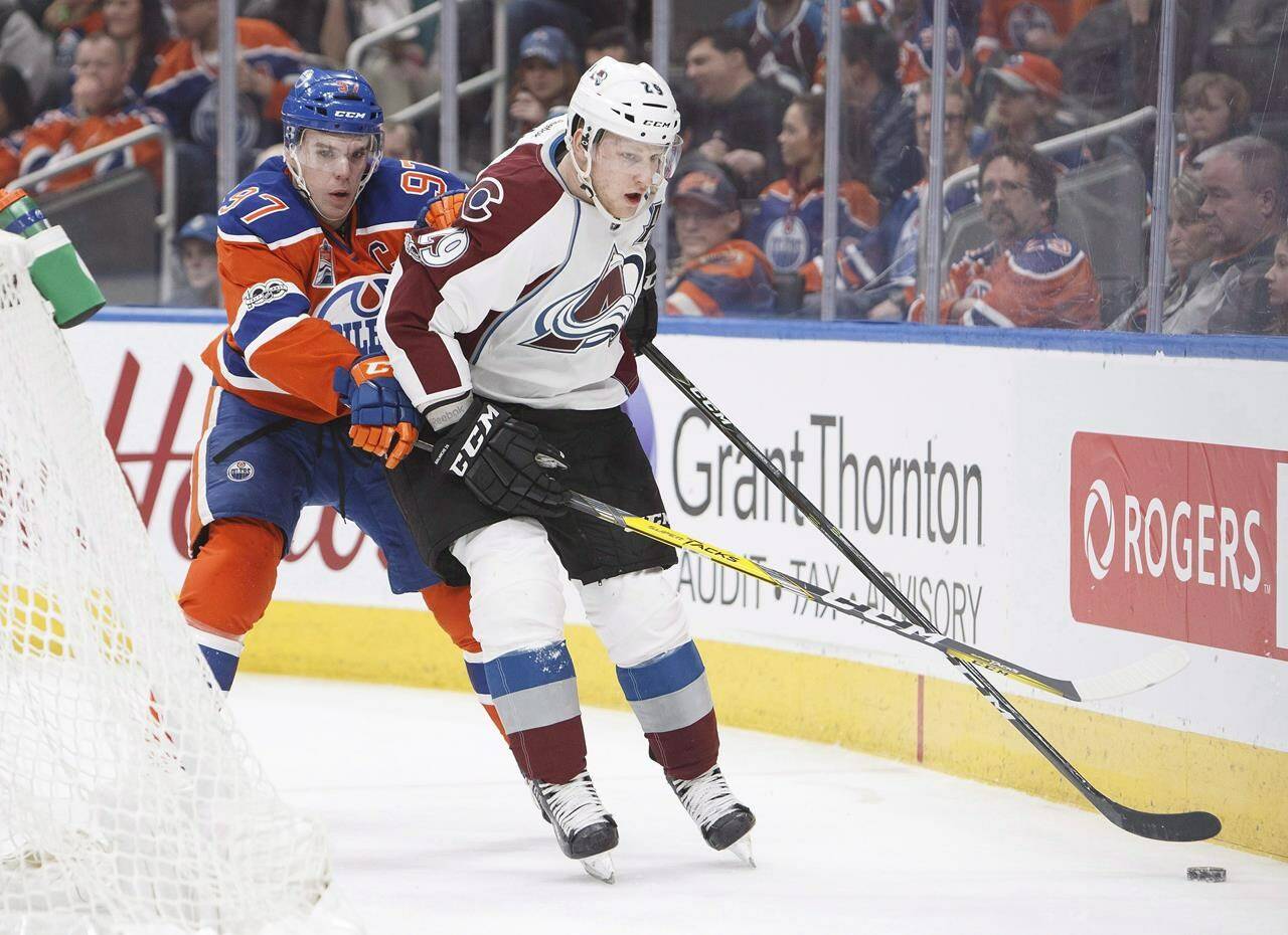 Edmonton Oilers' Connor McDavid (97) ties up Colorado Avalanche's Nathan MacKinnon (29) during third period NHL action in Edmonton on Saturday, March 25, 2017. THE CANADIAN PRESS/Codie McLachlan