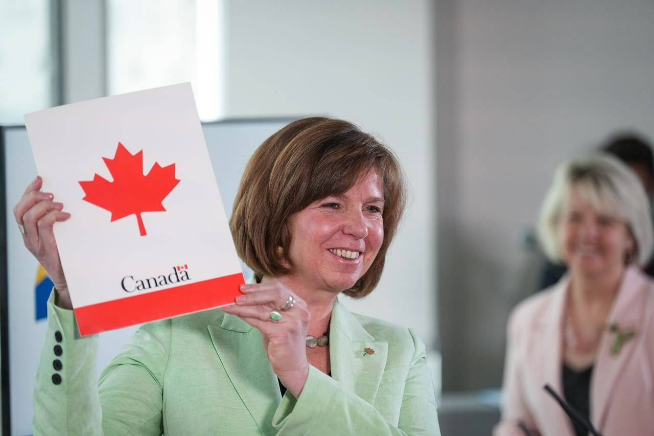 B.C. Minister of Mental Health and Addictions Sheila Malcolmson holds a copy of exemption documents in Vancouver on Tuesday, May 31, 2022, after British Columbia was granted authority to decriminalize possession of some hard drugs for personal use. 2022. THE CANADIAN PRESS/Darryl Dyck