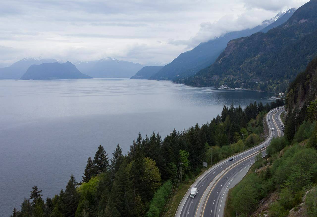 Motorists travel on the Sea-to-Sky highway between Horseshoe Bay and Lions Bay, B.C., on Friday, April 23, 2021. The employer of striking transit workers in B.C.’s Sea-to-Sky region says it is “evaluating its options” after a tentative agreement reached through mediation was rejected despite being recommended by the workers’ bargaining committee.THE CANADIAN PRESS/Darryl Dyck