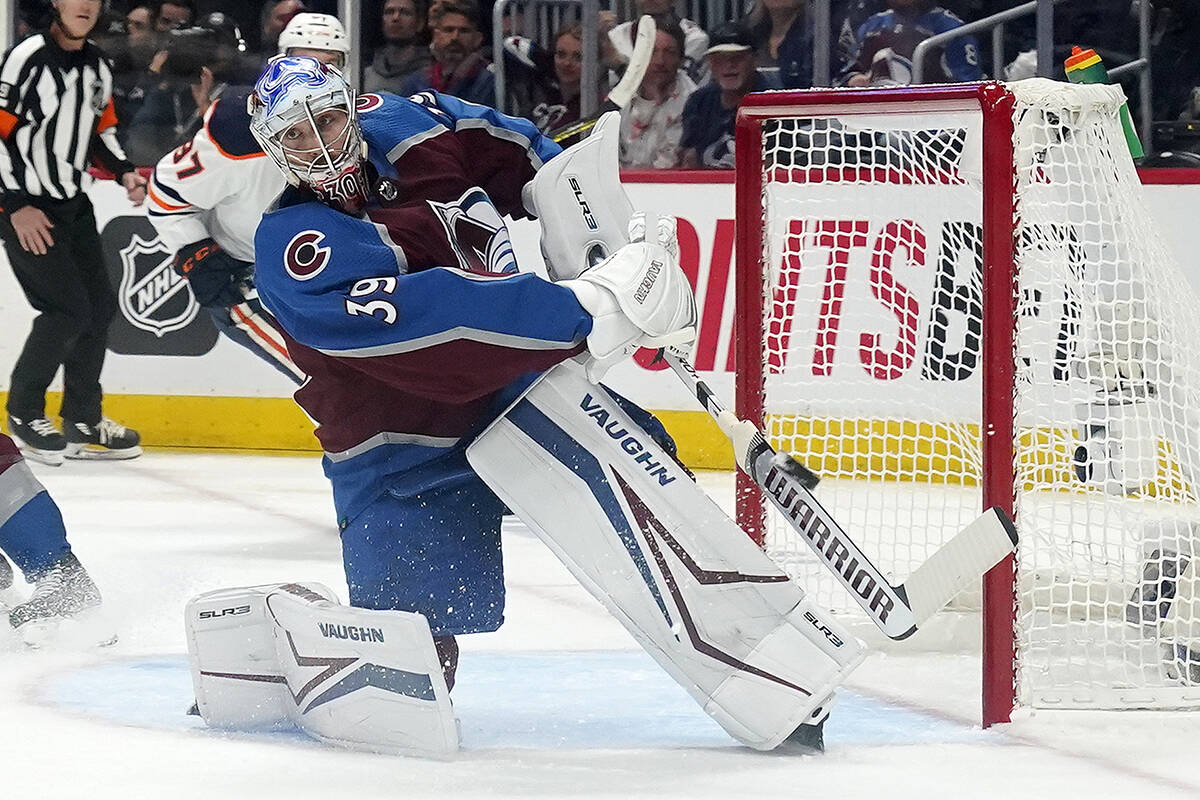 Colorado Avalanche goaltender Pavel Francouz (39) clears the puck during the second period in Game 2 of the team’s NHL hockey Stanley Cup playoffs Western Conference finals against the Edmonton Oilers on Thursday, June 2, 2022, in Denver. (AP Photo/Jack Dempsey)