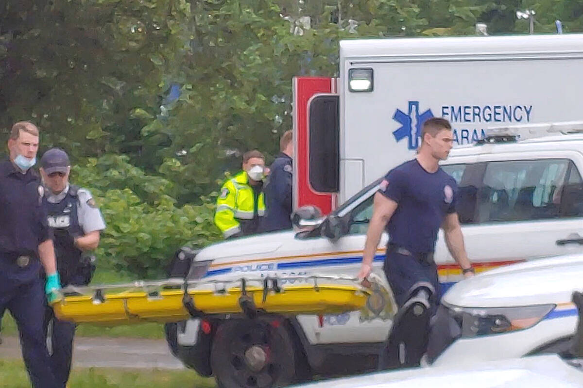 RCMP, Firefighters and B.C. Ambulance paramedics prepare to leave the scene after an injured man was placed in an ambulance following an alleged assault in Caledonia Park in Nanaimo on Friday, June 3. (Chris Bush/News Bulletin)