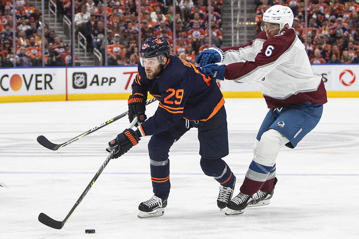 Colorado Avalanche defenceman Erik Johnson (6) and Edmonton Oilers forward Leon Draisaitl (29) battle for the puck during second period NHL conference finals action in Edmonton on Saturday, June 4, 2022.THE CANADIAN PRESS/Jason Franson