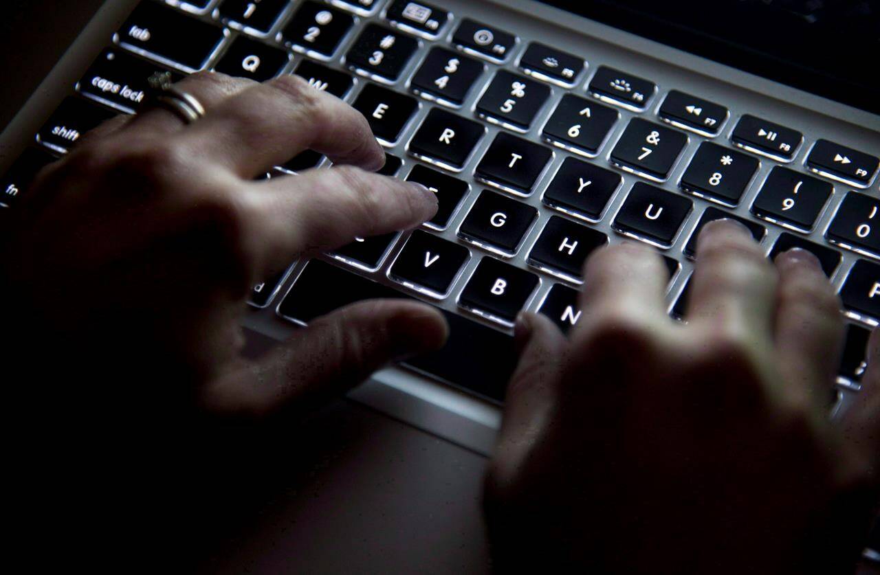 A woman uses her computer keyboard in North Vancouver, B.C., on December 19, 2012. Remote work flourished during the pandemic as companies closed their offices, but it has created a schism among Canadian workers as the economy starts to reopen.THE CANADIAN PRESS/Jonathan Hayward