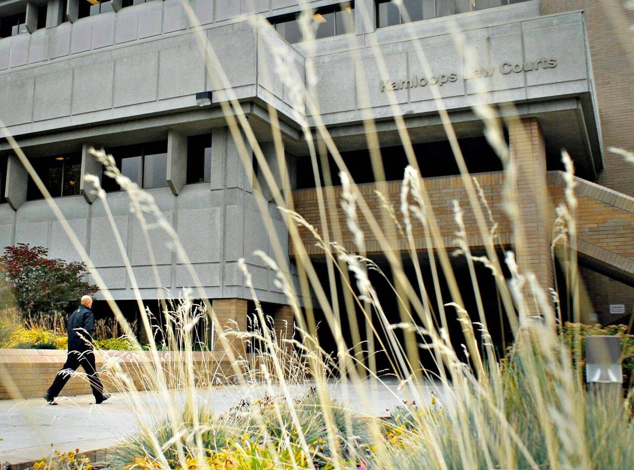 A man leaves the Kamloops Law Courts building, in Kamloops, BC on Tuesday, Oct. 13, 2009. A family court pilot project in British Columbia may be a promising solution for domestic violence victims trying to navigate a confusing and intimidating legal system, advocates say. THE CANADIAN PRESS/ Daniel Hayduk