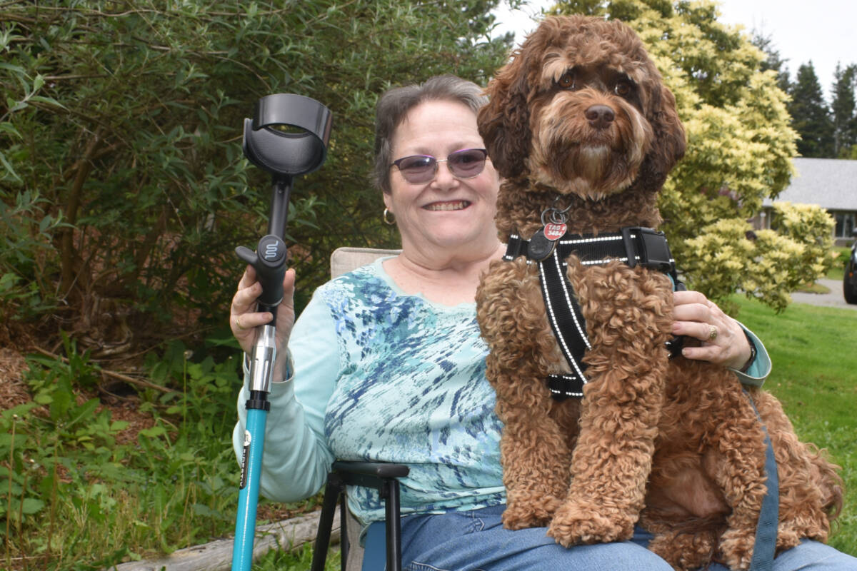 Linda MacMullen (seen here with her support dog, Bailey) is hopeful a new treatment for those living with myasthenia gravis will ultimately lead to more independence for her. Photo by Terry Farrell