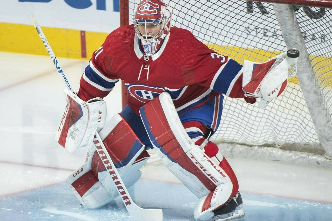 Montreal Canadiens goaltender Carey Price warms up prior to an NHL hockey game against the New York Islanders in Montreal, Friday, April 15, 2022. Price is the winner of the 2022 Bill Masterton Trophy. THE CANADIAN PRESS/Graham Hughes