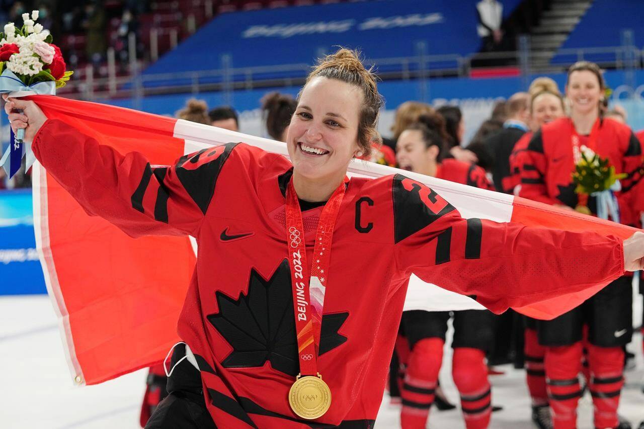 Team Canada forward Marie-Philip Poulin (29) celebrates with her gold medal after defeating the United States in women's hockey gold medal game action at the 2022 Winter Olympics in Beijing on Thursday, Feb. 17, 2022. The National Hockey League club announced Tuesday that Poulin, a four-time Olympic medallist with Canada’s national women’s hockey team, is joining the team as a part-time player development consultant. THE CANADIAN PRESS/Ryan Remiorz