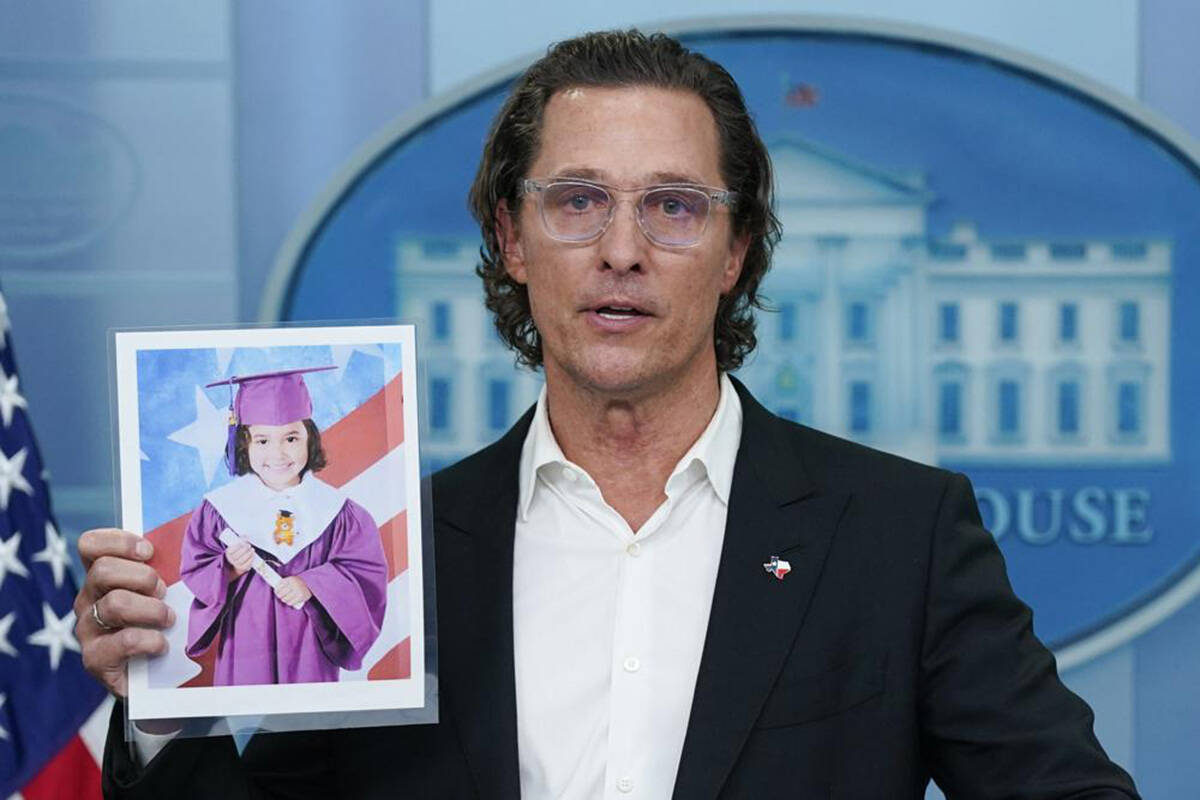 Actor Matthew McConaughey holds an image of Alithia Ramirez, 10, who was killed in the mass shooting at an elementary school in Uvalde, Texas, as he speaks during a press briefing at the White House, Tuesday, June 7, 2022, in Washington. (AP Photo/Evan Vucci)