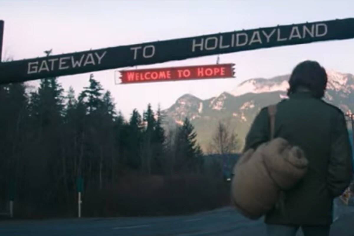 The ‘Gateway to Holidayland’ sign in the Rambo franchise’ first film, First Blood. (Youtube screenshot)