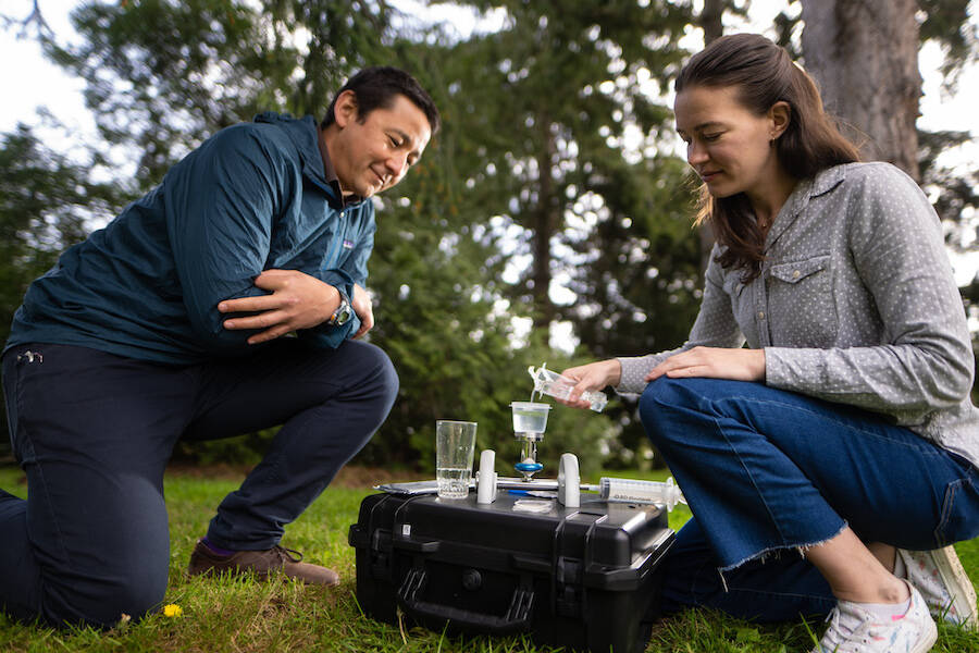 Caetano Dorea and Camille Zimmer, a professor and PhD candidate at the University of Victoria test drinking water using a filtration technique that will be used in many projects supported by the grant funding. Photo courtesy of UVic News/Armando Tura.