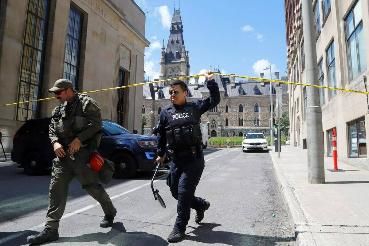 Police respond to an incident on Parliament Hill in Ottawa on Saturday, June 11, 2022. THE CANADIAN PRESS/ Patrick Doyle