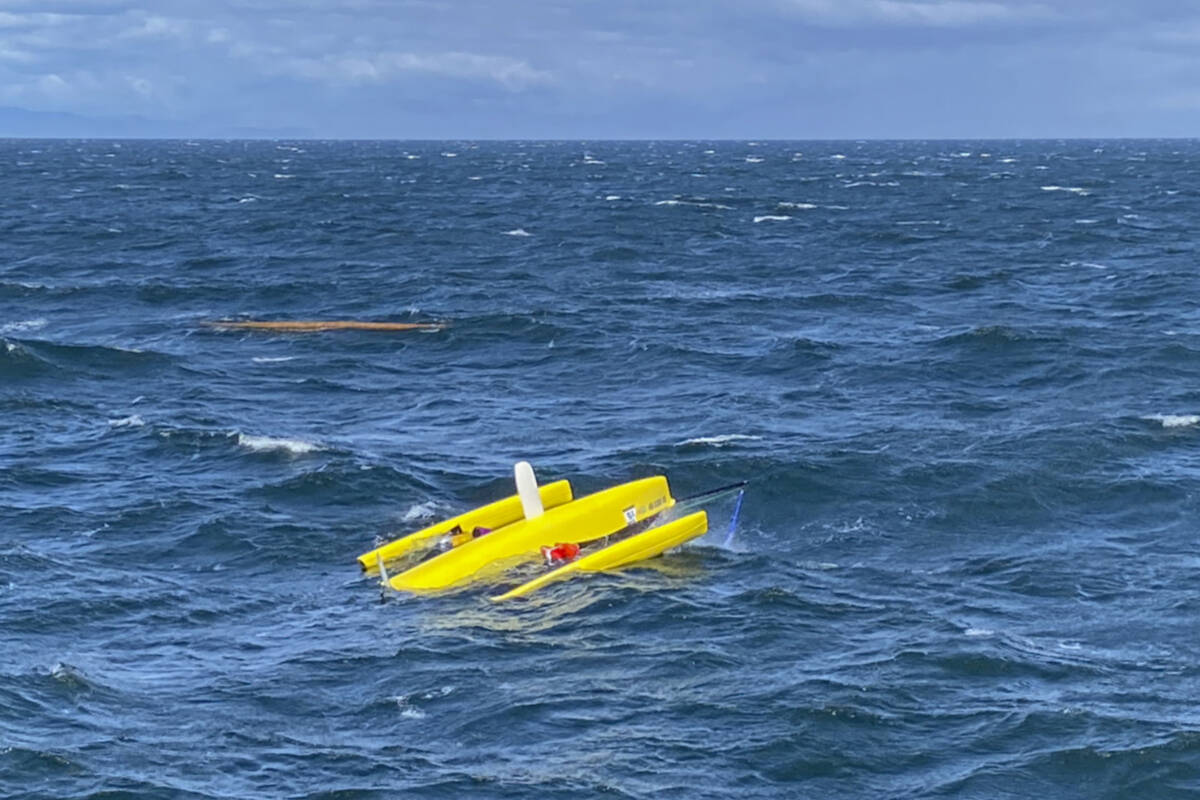 A trimaran sailing vessel capsized in the Strait of Juan de Fuca on Monday, June 13. (USCG Pacific Northwest/Twitter)
