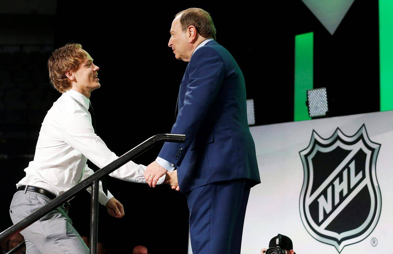 The Vancouver Canucks have signed defenceman Filip Johansson to a two-year entry-level contract. Filip Johansson, left, of Sweden, is greeted by NHL Commissioner Gary Bettman after being selected by the Minnesota Wild during the NHL hockey draft in Dallas, Friday, June 22, 2018. (AP Photo/Michael Ainsworth)
