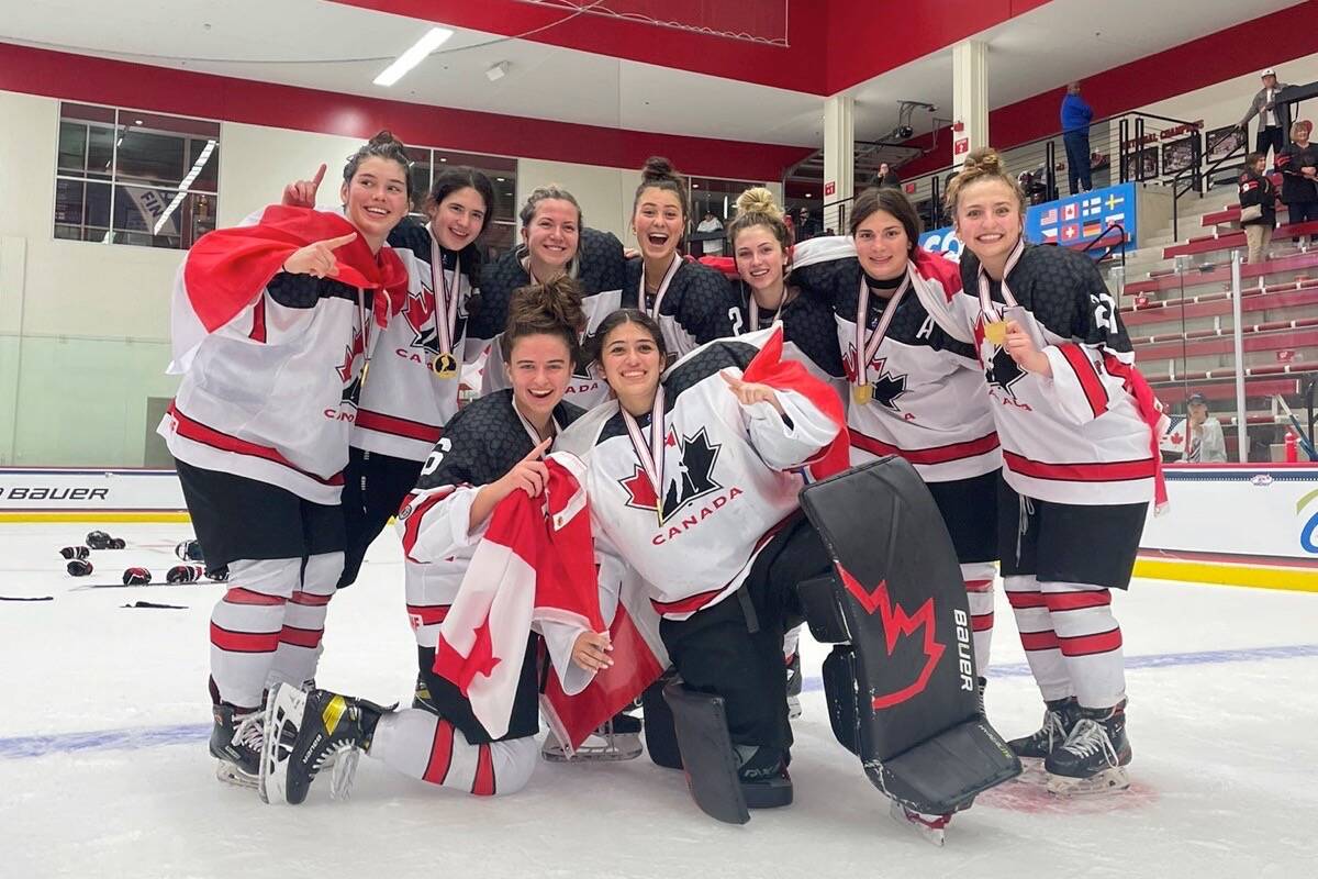 Team Canada players celebrate after beating Team USA 3-2 in the final game of the 2022 IIHF U18 Women’s World Championship on Monday, June 13 at LaBahn Ice Arena in Madison, Wis. (@IIHFHockey/Twitter photo)