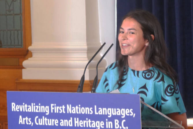 Autumn Cooper, right, of the Stz’uminus First Nation speaks about her experiences learning her traditional language, at an event announcing provincial funding for Indigenous language, art, culture and heritage revitalization at the legislature June 14. (Evert Lindquist/News Staff)