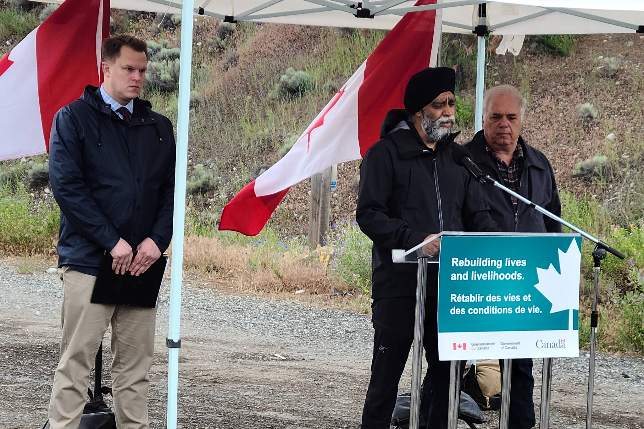 Minister of International Development Harjit Sajjan (centre) announced $77 million in federal funding toward rebuilding efforts in Lytton after the community was almost entirely destroyed by wildfires. MP Brad Vis (left) and Lytton Mayor Jan Polderman (right) attended the announcement. (Photo/Diana Campbell)
