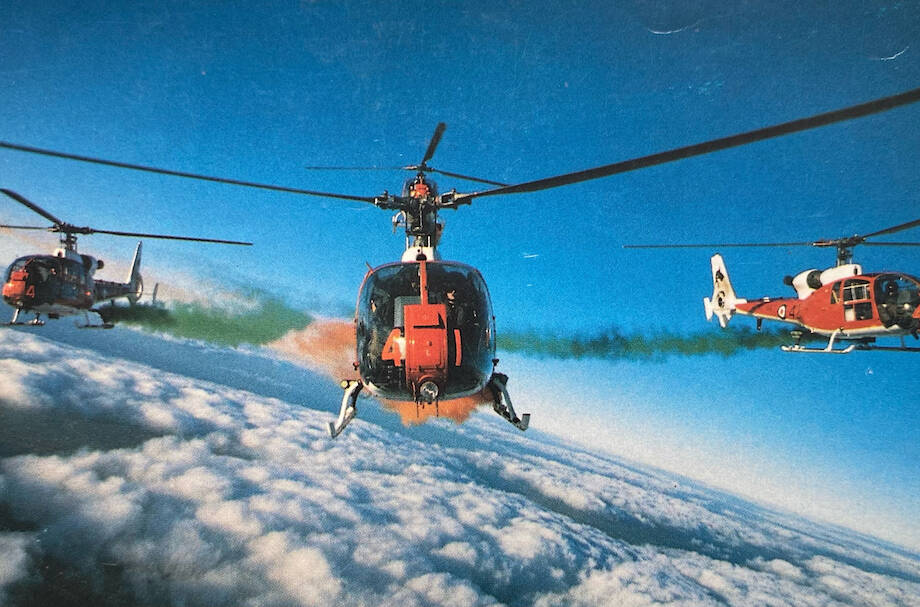 Treverton (middle) flying helicopters with the Royal Navy display team in 1988. Photo: Vince Treverton