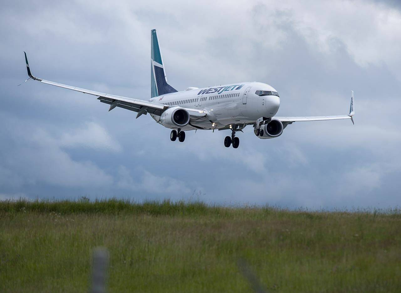 A WestJet flight from Calgary arrives at Halifax Stanfield International Airport in Enfield, N.S. on Monday, July 6, 2020. Industry watchers expect WestJet to remove routes from the Toronto-Montreal-Ottawa triangle as part of the Calgary-based airline’s new strategy to focus future growth on Western Canada. THE CANADIAN PRESS/Andrew Vaughan