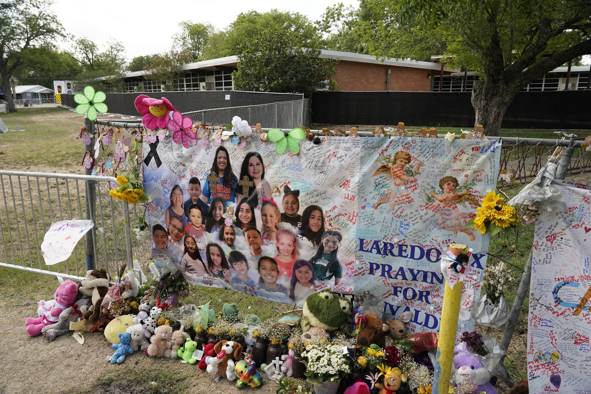 Robb Elementary School sits behind a memorial created to honour the victims killed in the recent school shooting, Thursday, June 9, 2022, in Uvalde, Texas. (AP Photo/Eric Gay)