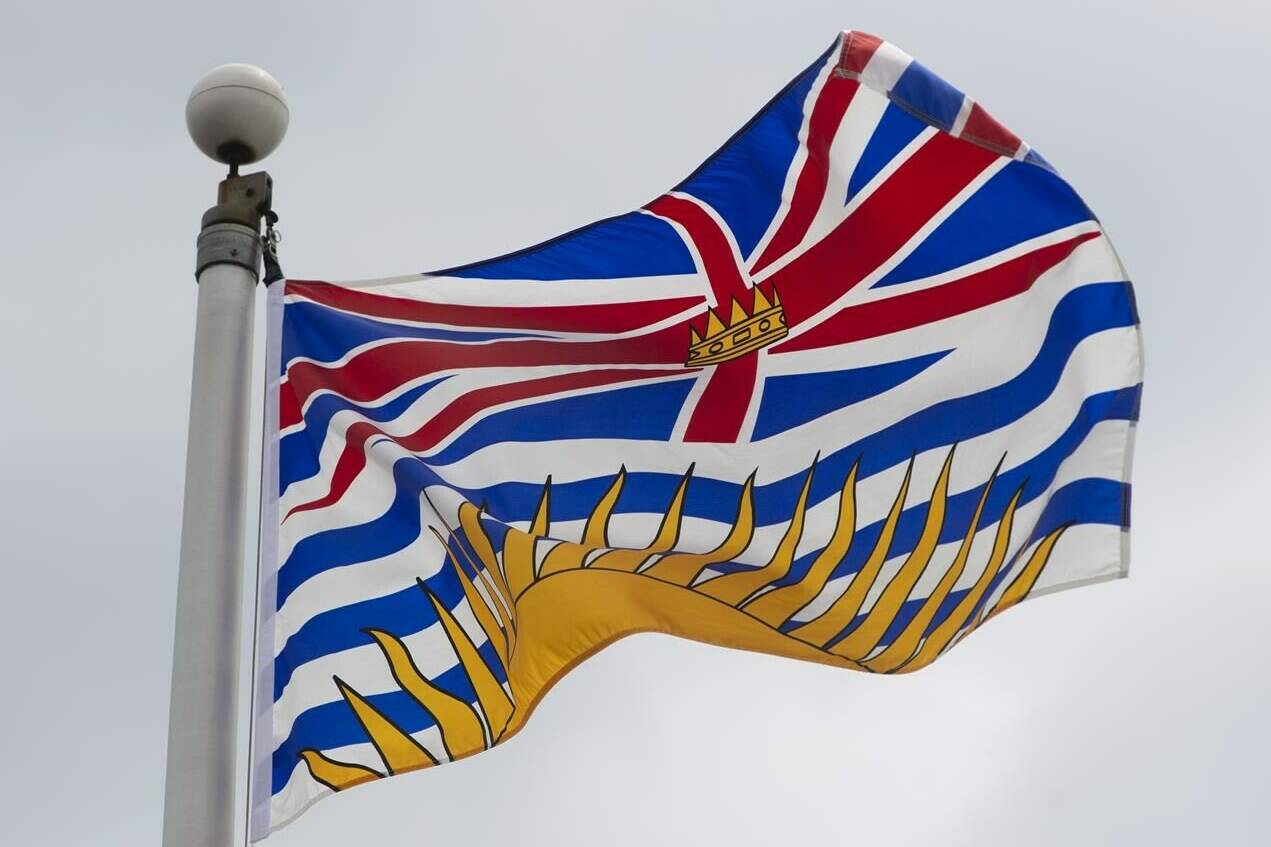 British Columbia's provincial flag flies in Ottawa on Friday July 3, 2020. Environment Canada says the first hot spell of the year is about to settle over much of British Columbia, bringing temperatures in the low to mid-30s until at least early next week.THE CANADIAN PRESS/Adrian Wyld