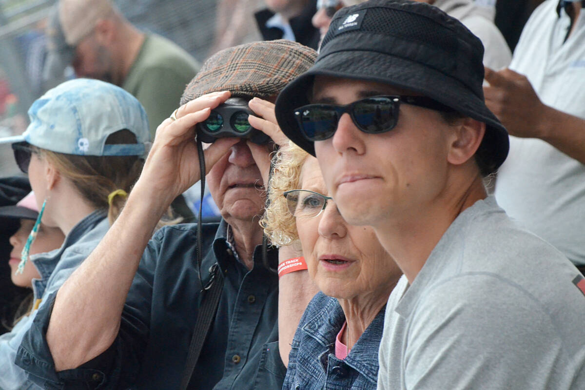 Peter and Ann Withers, with their grandson Ethan Wilkie, watched the 100m qualifying races at the Bell Canadian Track and Field Championships Thursday morning. Wilkie, who grew up in Langley and Abbotsford, is competing for the University of New Brunswick in the 400m race. (Matthew Claxton/Langley Advance Times)