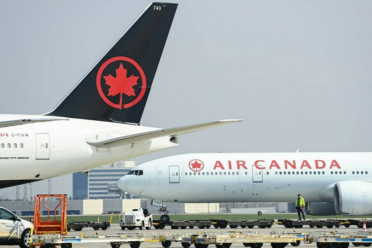 Air Canada planes sit on the tarmac at Pearson International Airport in Toronto on Wednesday, April 28, 2021. THE CANADIAN PRESS/Nathan Denette